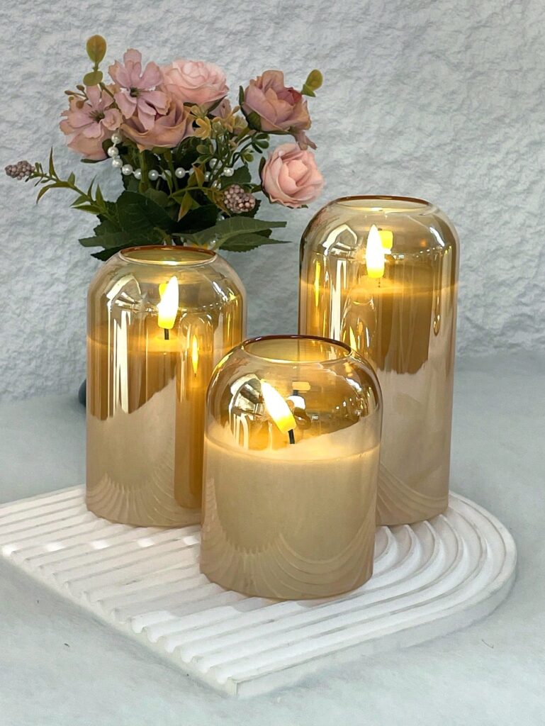 Set of three flameless candles with pink flowers